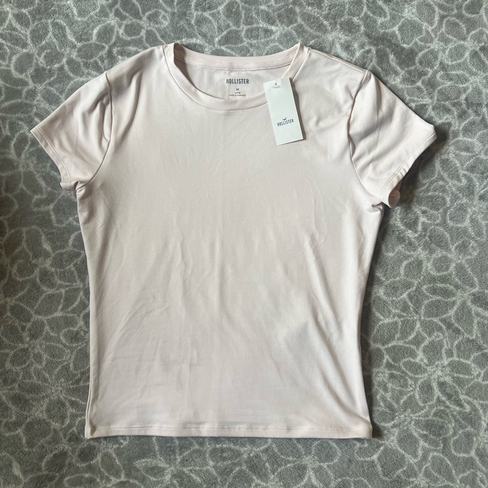 NWT light pink Hollister baby tee